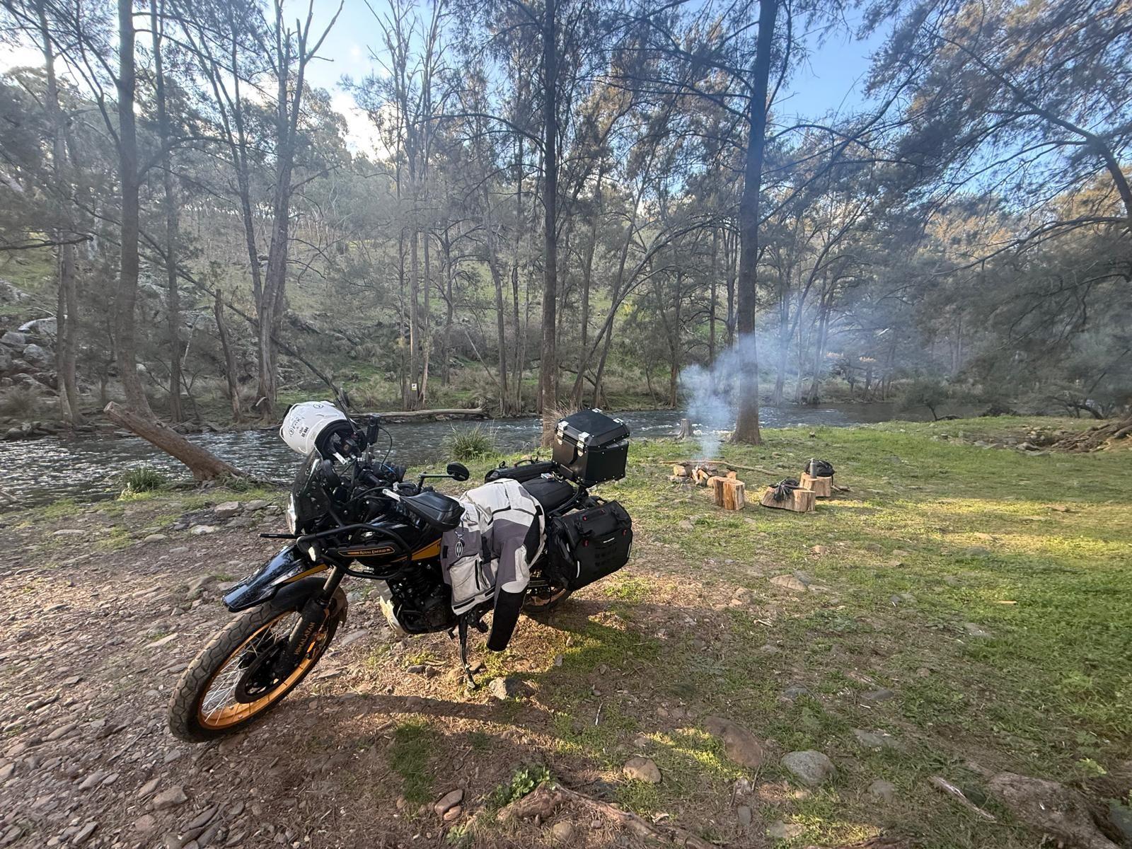 Hunter parked beside a creek, Mitas Dakar tyres still carrying the day's grit and clay