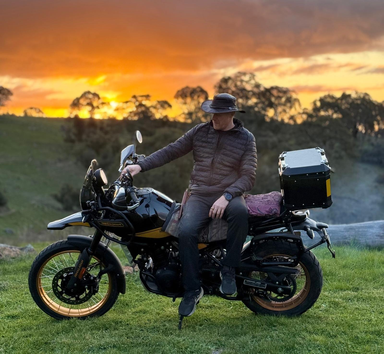 Robin and Hunter at golden hour, low sun behind the hills